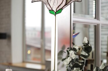 Interior magnolia on a brass stand: it catches the light at eye level