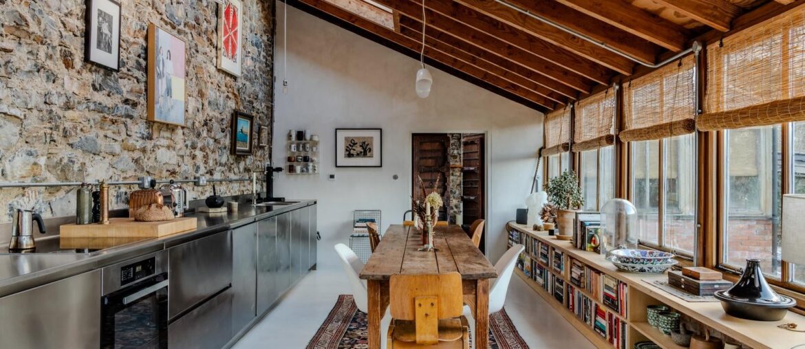 Kitchen and dining space in a formerly abandoned Victorian walled garden transformed into a house largely built using brick and local stone, Bampton, northeast Devon, England [1600x1067]