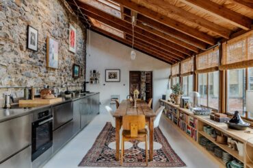 Kitchen and dining space in a formerly abandoned Victorian walled garden transformed into a house largely built using brick and local stone, Bampton, northeast Devon, England [1600x1067]