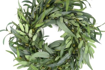 How can I hang this up on the inside but so you can see it from outside? We live in a new construction area and there is so much dust. I have a big glass window in my door so how can I hang this so you can still see the wreath through the window (facing outward) but keep it clean?