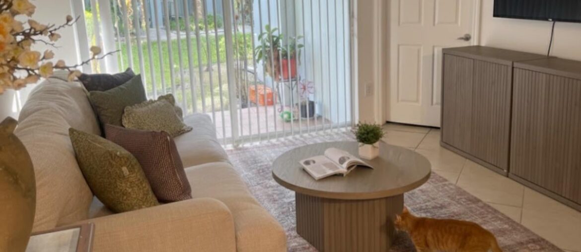 Should I change the coffee table to a lighter color or keep the same color to match the table under the tv?