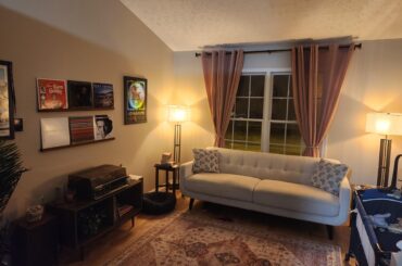 Looking for suggestions on how to improve this room. I like the colors, but it feels a bit bland.