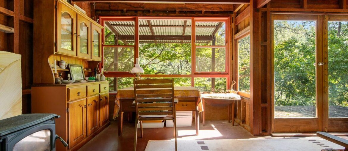 Living space surrounded by nature views in a former miner’s cottage in Moruya, New South Wales, Australia [1200x900]