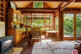 Living space surrounded by nature views in a former miner’s cottage in Moruya, New South Wales, Australia [1200x900]