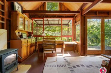 Living space surrounded by nature views in a former miner’s cottage in Moruya, New South Wales, Australia [1200x900]