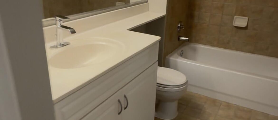 how to bring life into this bathroom? what goes with brown tile?