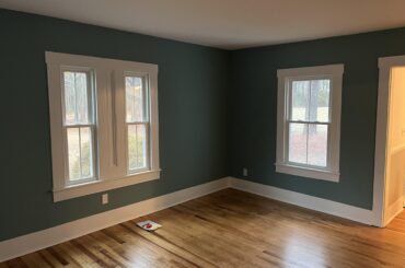 Any suggestions for rugs in this room? I’m struggling. This color is A LOT for us. It’s a rental home so can’t change.