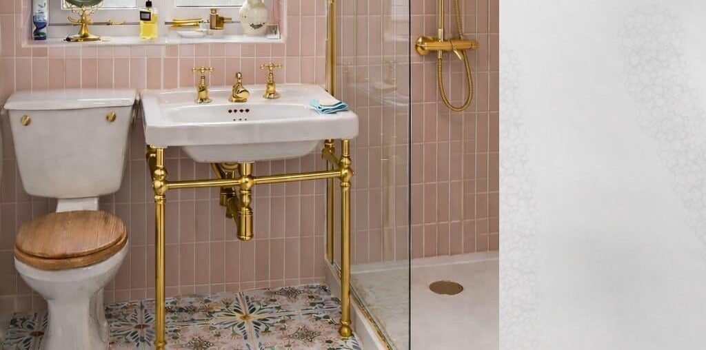 Are the gold fixtures and pink wall tiles going a step too far?