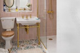 Are the gold fixtures and pink wall tiles going a step too far?