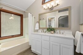 Paint color or wallpaper ideas to match mint green tile in bathroom.
