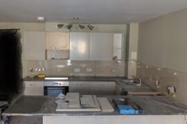 Something is wrong with the wall, cabinets and backsplash