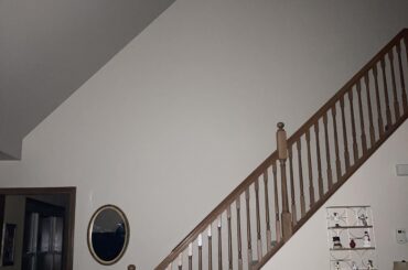 This huge wall going up the stairs is so... plain. Is there anything that I could do to make it interesting?