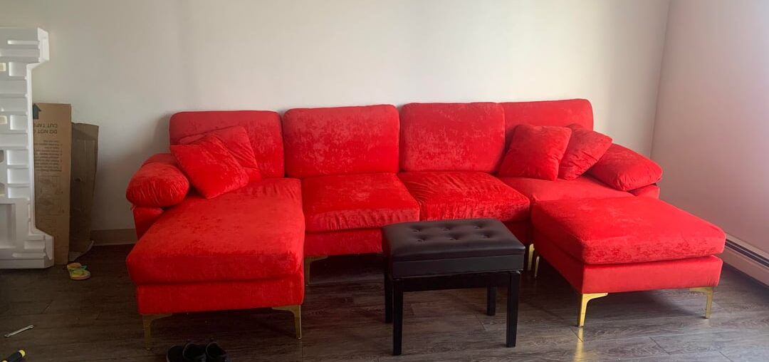 I need help finding an area rug that matches my couch and feature art piece