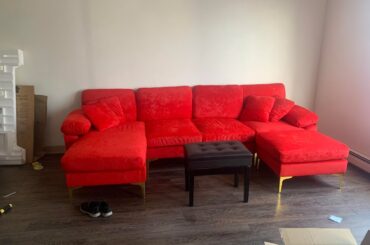 I need help finding an area rug that matches my couch and feature art piece