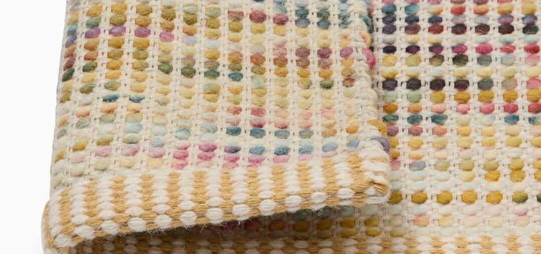 How do “sweater rugs” or “wool bubble rugs” wear? Are they practical?