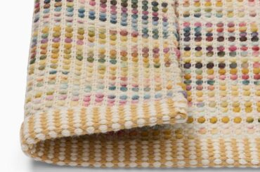 How do “sweater rugs” or “wool bubble rugs” wear? Are they practical?