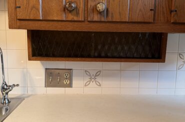 What’s the purpose of these vintage small storage spaces with glass sliding doors?