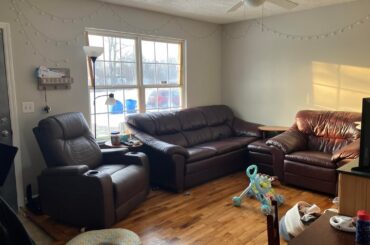 I realize I have a lot of mismatch furniture and clutter currently but what color/style curtains would look best to tie this room together