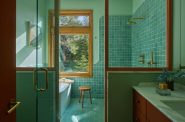 Main bathroom full of natural light and a glass partition in a renovated 1964 Mid-century modern Tahoe residence, Alpine Meadows, California [2880x1921]
