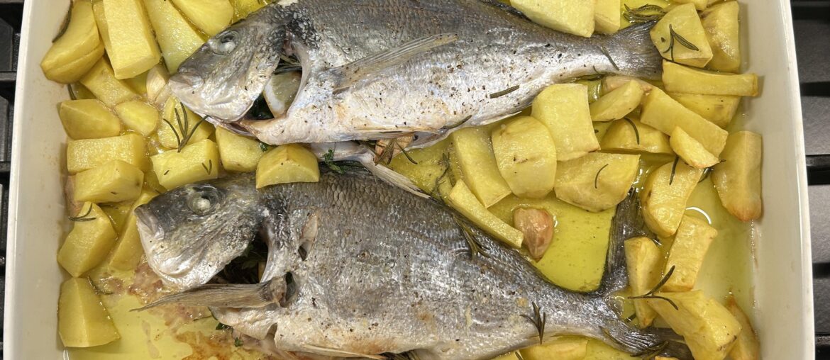 Baked orate with potatoes