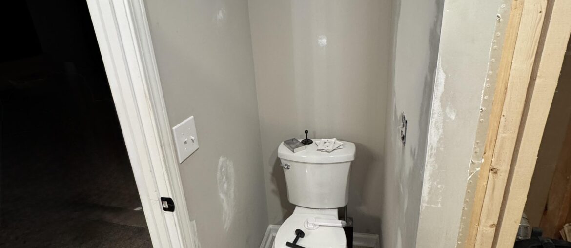 Toilet paper holder placement