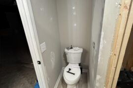 Toilet paper holder placement