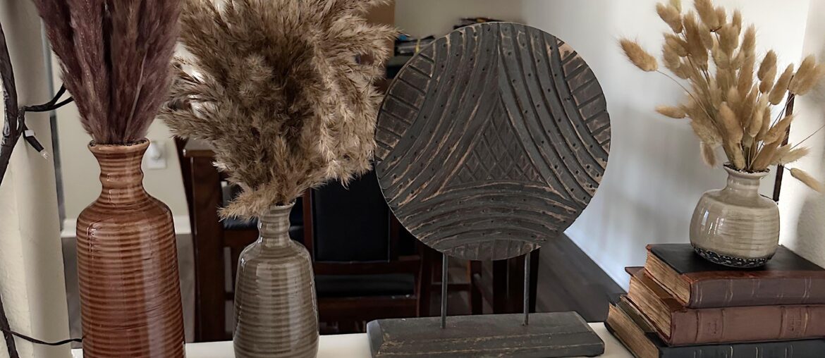 I decorated this little space in the entry way of my apartment. Is the grass a bit much?