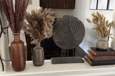 I decorated this little space in the entry way of my apartment. Is the grass a bit much?