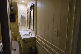 Small but tall bathroom with old wainscotting