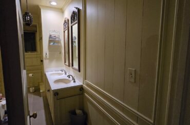 Small but tall bathroom with old wainscotting