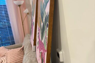 Is this wood frame of this wall art too dark for the light wood in the room?