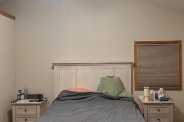 What would you do with the wall above our bed given its lack of symmetry?