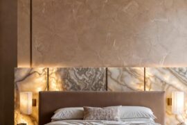 Warm luxury bedroom with backlit marble headboard [1152×2048]