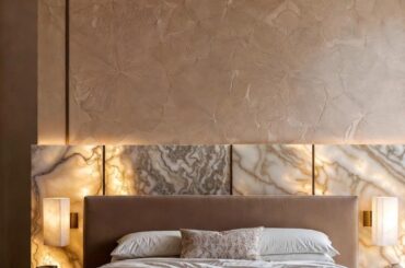 Warm luxury bedroom with backlit marble headboard [1152×2048]