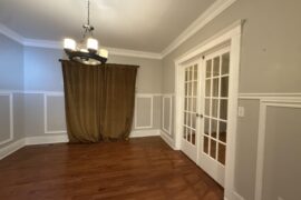 I am trying to figure out how to paint this dining room. I was leaning towards a darker color, and am wondering if I should paint over all of the wainscoting or leave it white or cream.