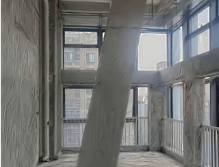 I bought an apartment with a pillar in the middle. Can any expert help me design it to make the pillar look better?