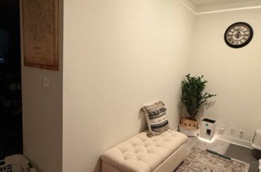 What artwork would you put above the ottoman in my den area?