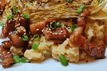 Baked pointed cabbage on rutabaga puree with glazed pork belly