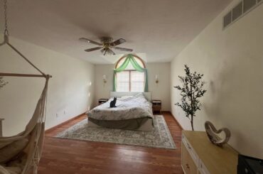 How would you decorate the walls of this long bedroom?