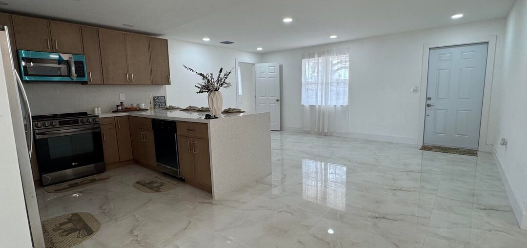 Closing on this home soon and unsure how to stage the living area. My L-shaped couch doesn’t flow well. The dining table fits under the kitchen light, but the small living space is tricky. I also have a TV with stand. Looking for layout ideas to make the space feel open.