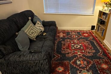 I want to add an arm chair to this room to increase seating. What colour/ style? Cream like image 2? Or something else?