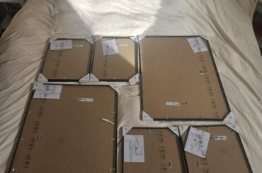 Four 11x15 inch and two 19x27 inch wall frame placement ideas (vertical because of art)