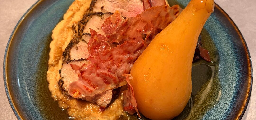 Pork tenderloin with celeriac püré, spiced poached pear and prosciutto chips