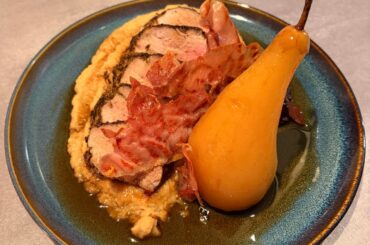 Pork tenderloin with celeriac püré, spiced poached pear and prosciutto chips