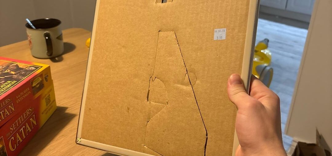 Want to hang this 20x20 mirror, but it has a cardboard backing I don’t want to damage how do I hang it securely?