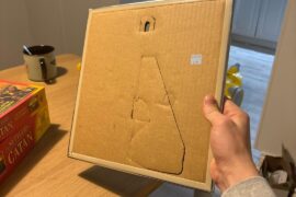 Want to hang this 20x20 mirror, but it has a cardboard backing I don’t want to damage how do I hang it securely?