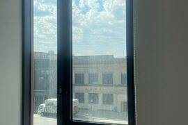 How to hang curtains on this big bedroom window next to wall