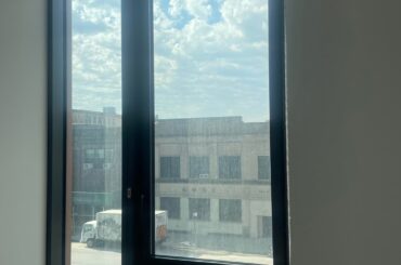 How to hang curtains on this big bedroom window next to wall