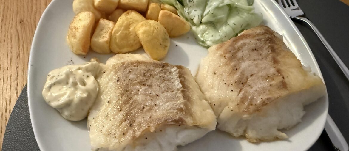 Fried cod with potatoes and cucumber salad