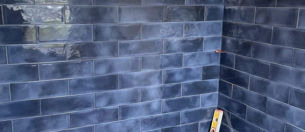 What navy blue paint color would match with our tiles? Please include the brand